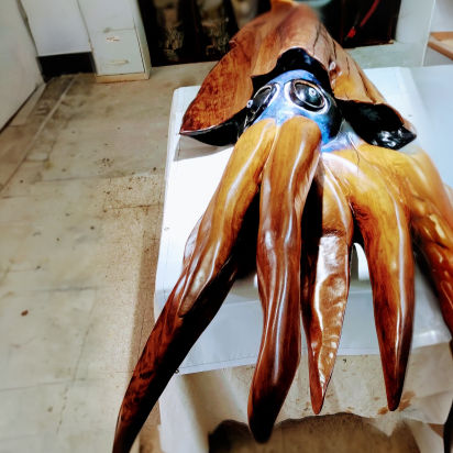 Hand-carved cypress fish sculpture